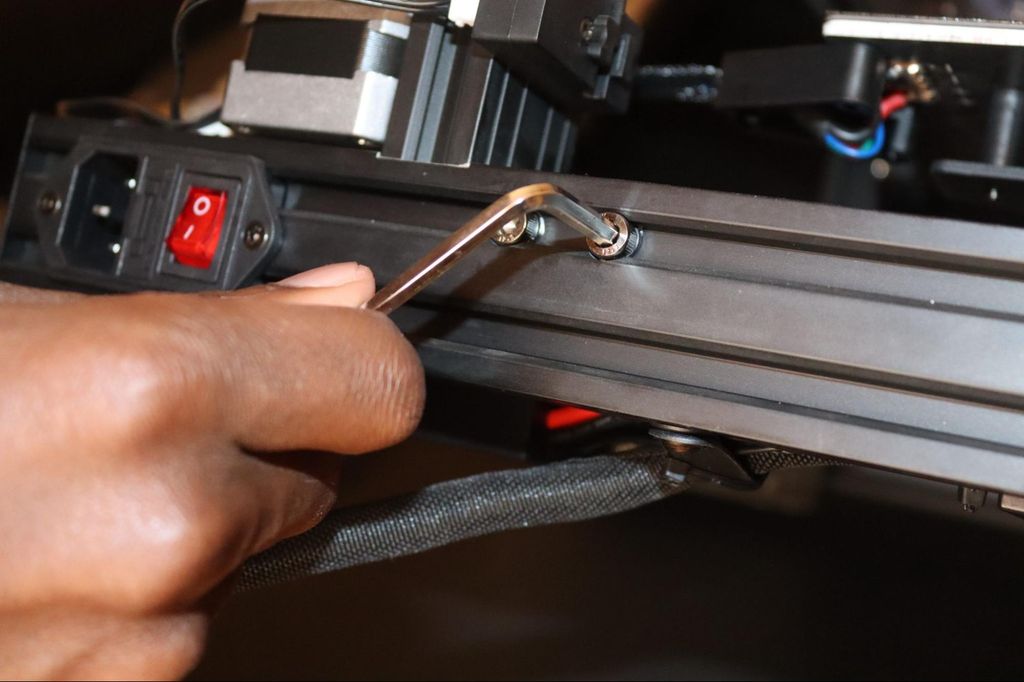 Tightening the screws of the printer