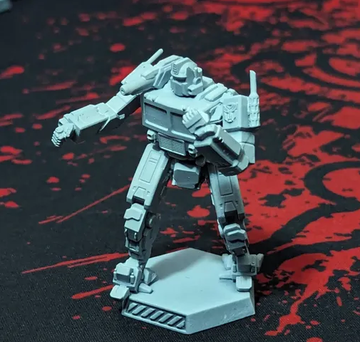 grey 3D printed miniature of the Optimus Prime Grasshopper GHR-5N mech