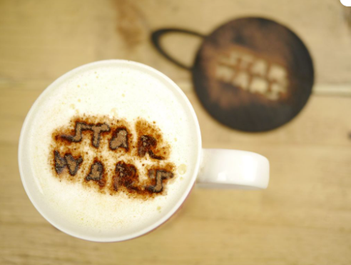 Star Wars cocoa powder latte art design made with a 3D printed coffee stencil