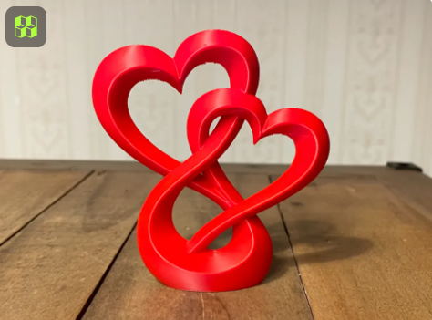 Red 3D printed interlocking heart statue.  