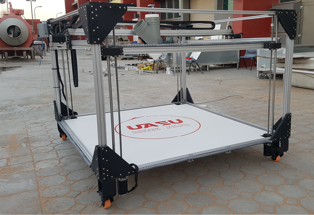 A large, open-frame Cartesian 3D printer demonstrating typical Cartesian X, Y, and Z motion mechanics.
