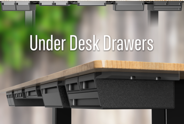 A row of sleek black 3D-printed under-desk drawers mounted seamlessly to the bottom of a wooden workstation.