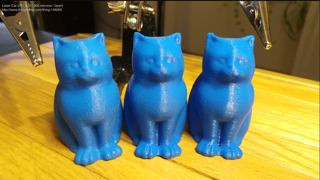 Comparison of three 3D printed cat models showing the visual difference between low, medium, and high layer heights