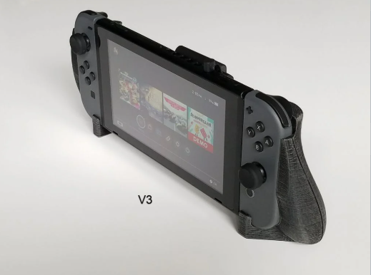 A Nintendo Switch console held securely inside a grey 3D printed ergonomic comfort grip.