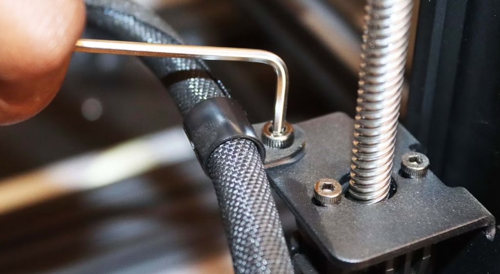 Tightening the harness of the printer