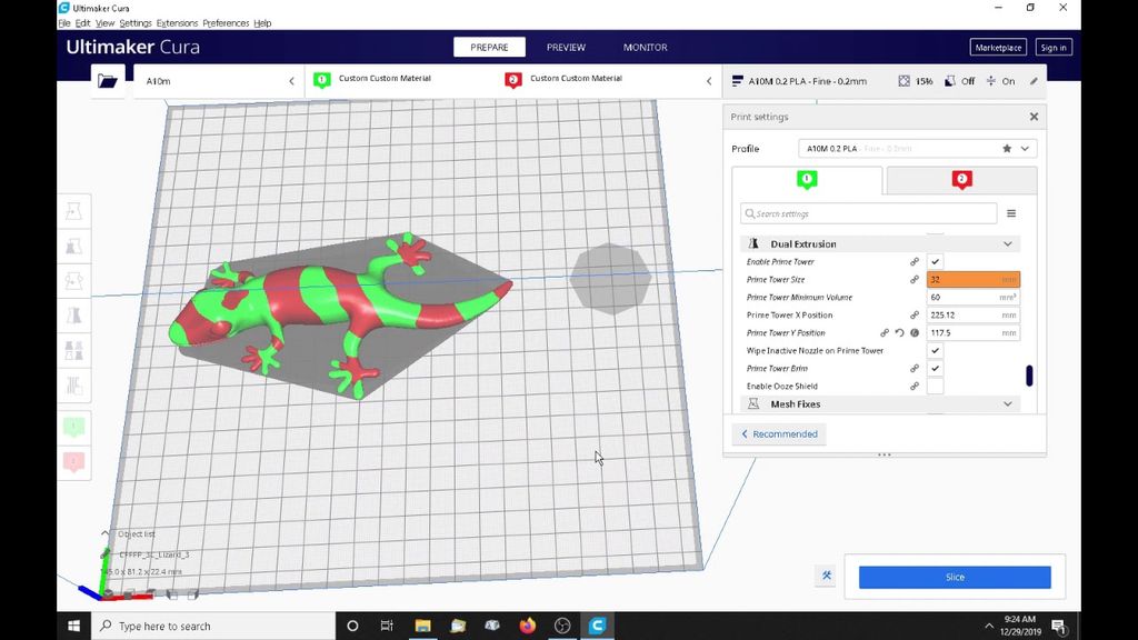Ultimaker Cura software interface showing a green and red dual-color 3D lizard model.  