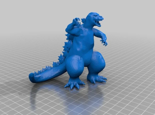 A blue 3D CAD rendering of Godzilla roaring and preparing to strike, standing on a digital grid workspace.