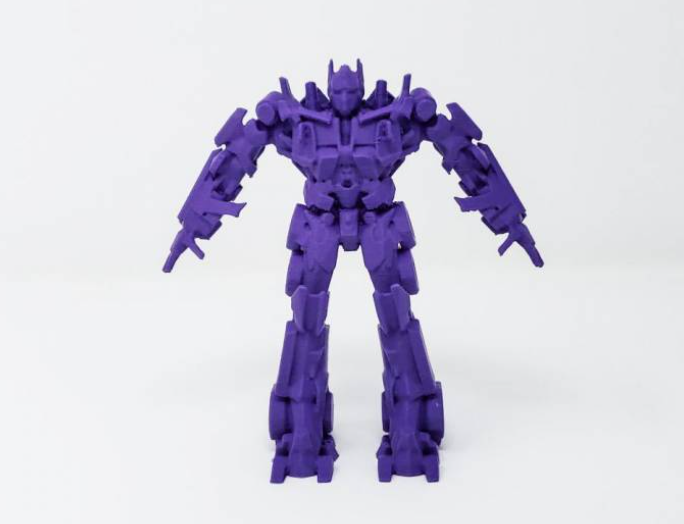 A solid, purple 3D printed model of Transformers Optimus Prime standing upright