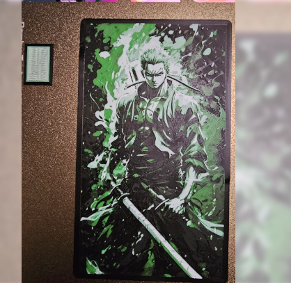 A framed HueForge 3D print of Roronoa Zoro from One Piece, utilizing layered black, green, and white filament to create a 2D art effect