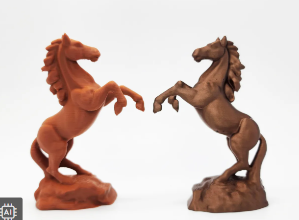 Two 3D-printed rearing horse sculptures in brown and dark metallic filaments.  