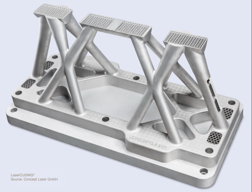 A silver, industrial 3D-printed metal component with complex supporting struts and lattice structures
