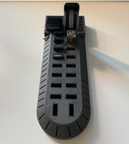 The black, elongated "Data Hoarder" 3D printed desk organizer