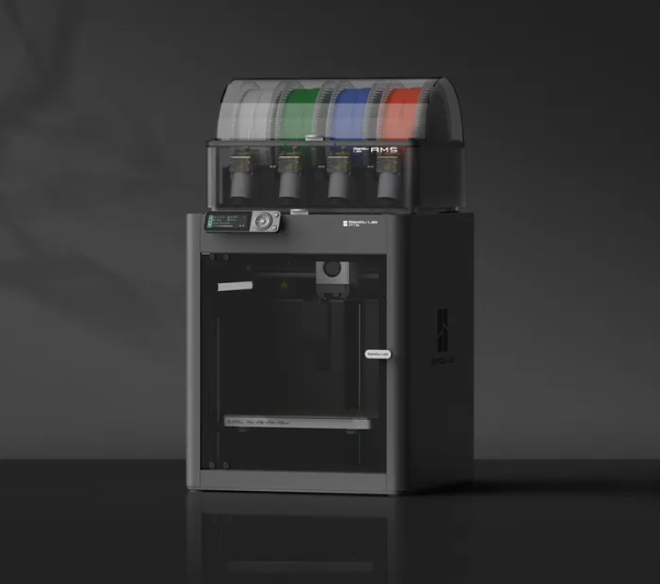 Dark grey, enclosed Bambu Lab P1S 3D printer featuring a 4-color Automatic Material System on top. 