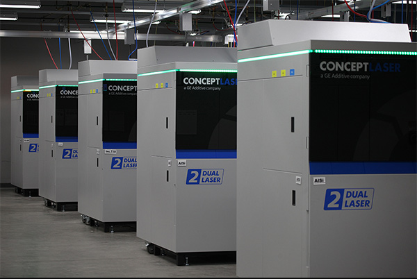 Row of Concept Laser dual laser metal 3D printers in a manufacturing facility
