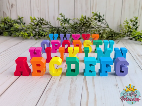 A collection of brightly colored, free-standing 3D-printed alphabet letters for early literacy learning.