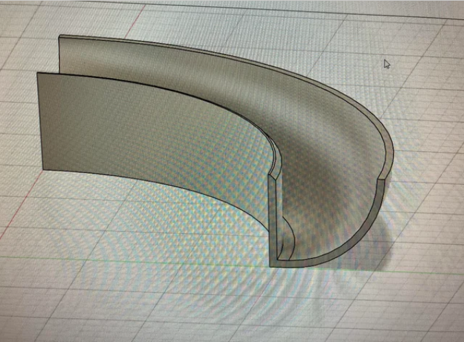 A 3D CAD design showing a curved surface that appears rough and faceted due to low resolution.  