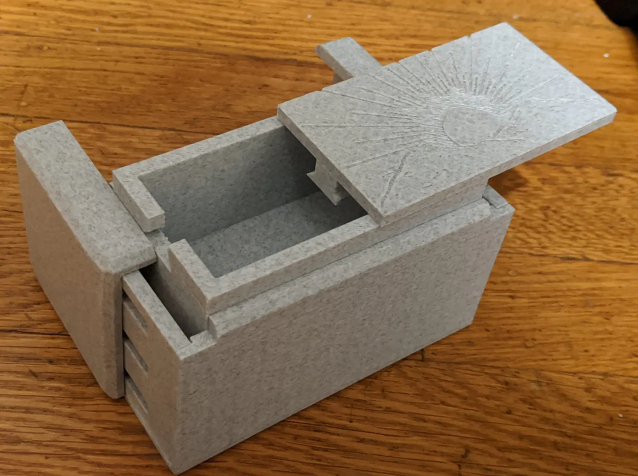 Stone-textured 3D printed rectangular puzzle box featuring a mysterious sliding lid and sequential mechanism