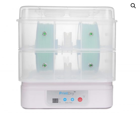 A PrintDry filament drying machine containing two spools of green 3D printing filament.  
