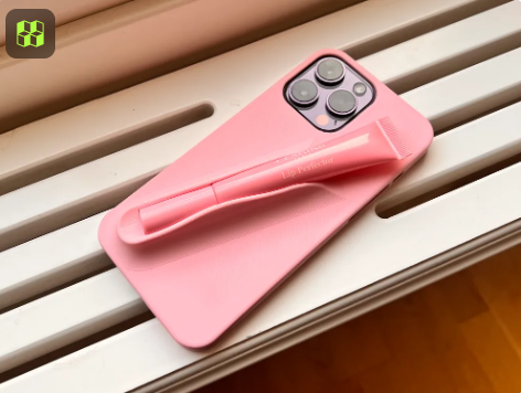 Pink fashion-inspired phone case with a built-in slot for lipgloss or makeup accessories.