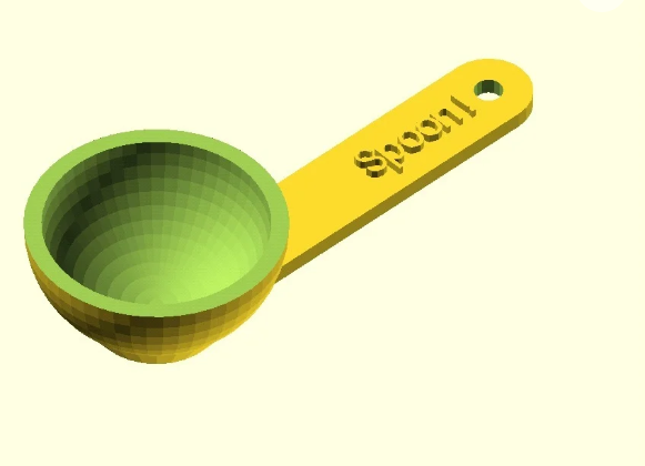 A digital 3D render of a green and yellow measuring spoon with the word "Spoon" embossed on its handle