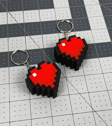 3D printed Minecraft health heart keychain featuring a mechanical fidget clicker mechanism