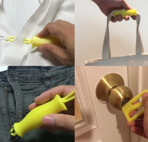 Yellow 3D-printed assist tool used for buttons, zippers, bags, and doorknobs.