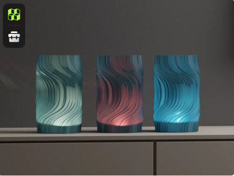 Three 3D printed twisted modern lampshades glowing in different RGB colors teal, red, and blue sitting side-by-side on a cabinet.