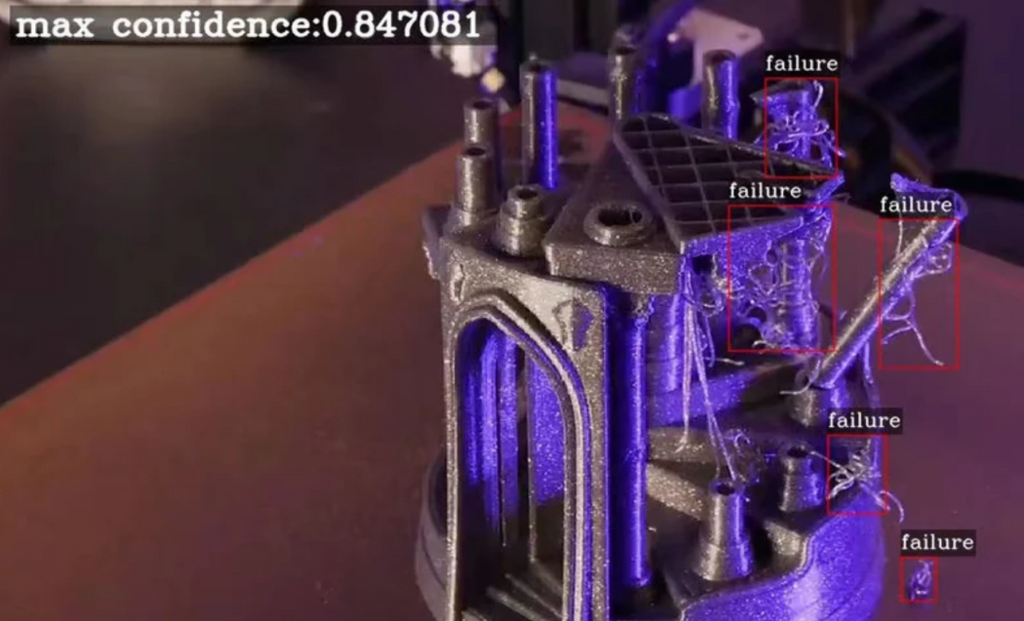 AI camera monitoring interface detecting a 3D print failure with automated pause notification