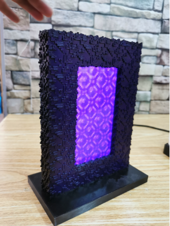Minecraft Nether portal-inspired 3D printed phone charging base in purple and obsidian black.