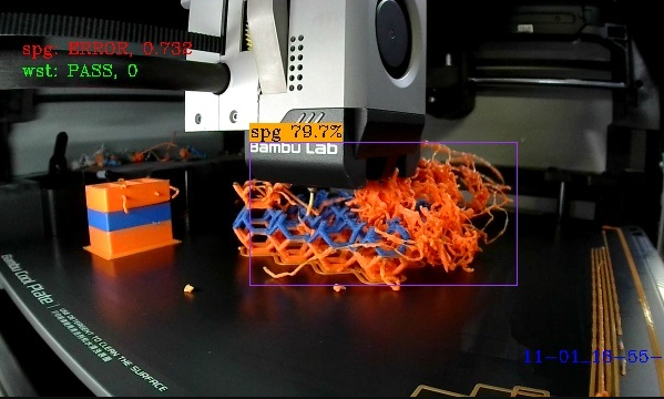 The Bambu Lab A1 Mini AI camera view detecting an orange spaghetti error with a purple bounding box.  