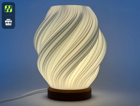 A simple 3D printed lampshade with a swirling, twisted vase-mode design resting on a dark circular wooden base