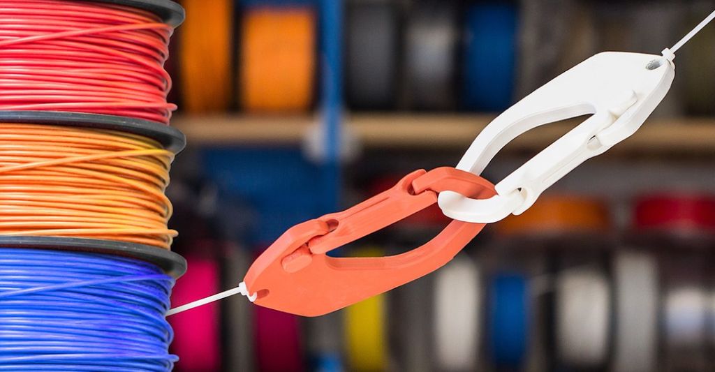 Interlocking 3D printed nylon clips demonstrating the material's strength and flexibility at functional layer heights.