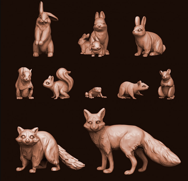 A collection of finely detailed 3D-printed miniature forest animals, including a fox, rabbits, frogs, and squirrels. 