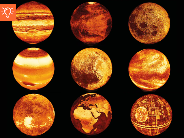 A collection of 3D printed lithophane planet lamps illuminated from within, glowing in warm orange and yellow tones against a dark background.