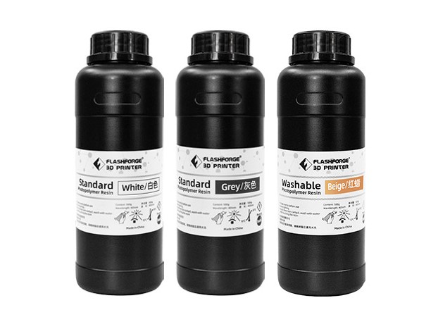 Three bottles of Flashforge standard and washable photopolymer resin for 3D printing. 