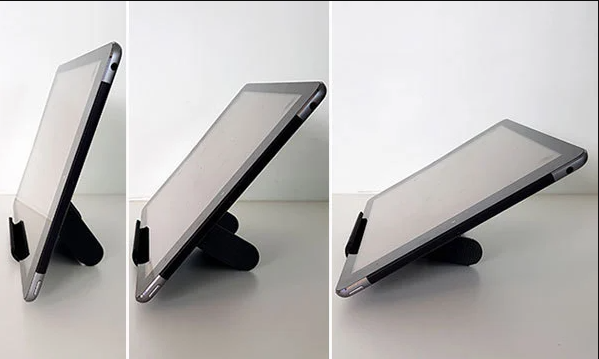 A gray and vibrant green 3D-printed dock with a sturdy triangular frame and a built-in slot for a charging cable.