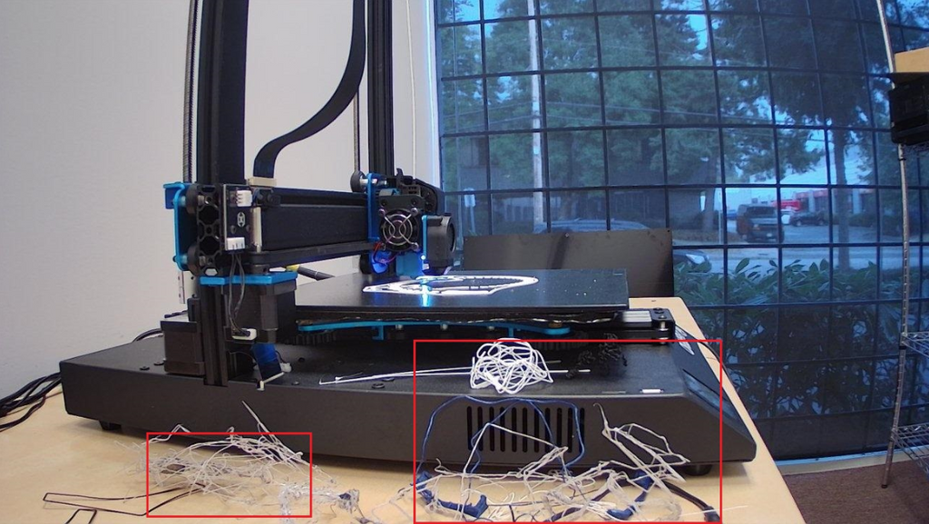 A QuinlyVision camera view highlighting tangled plastic spaghetti failures with red bounding boxes.  